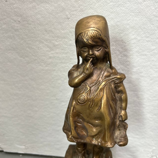 1950’s reproduction of Juan Clara’s Girl standing on a stool. Measures approximately 11.5 in height, 3.5 wide at widest,...