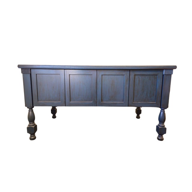 This gorgeous piece measures 40" wide, 38" tall and 72" long. It boasts solid turned legs, ample storage behind solid...