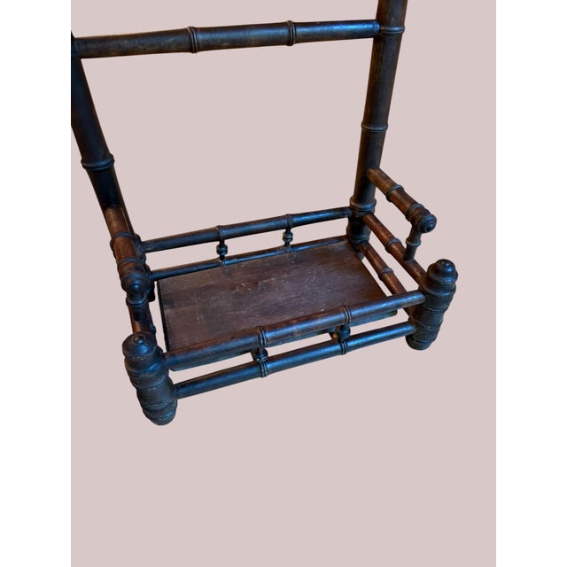 An elegant late 19th-century French faux-bamboo umbrella stand (porte-parapluie), capturing the height of the Victorian...