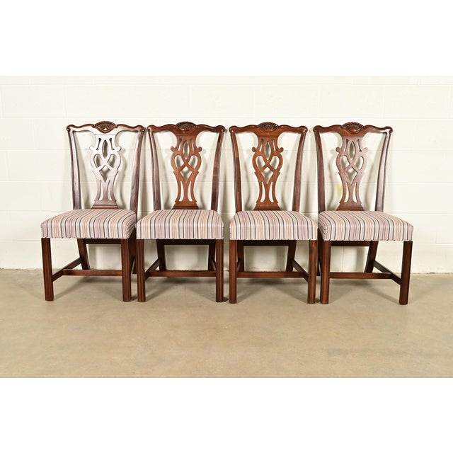 An outstanding set of four Chippendale or Georgian style dining chairs By Drexel Heritage USA, Circa 1980s Carved solid...