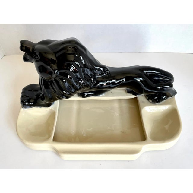 Here is a wonderful mid-century piece featuring a striking lion made of glazed pottery ceramic. The piece is perfect for...