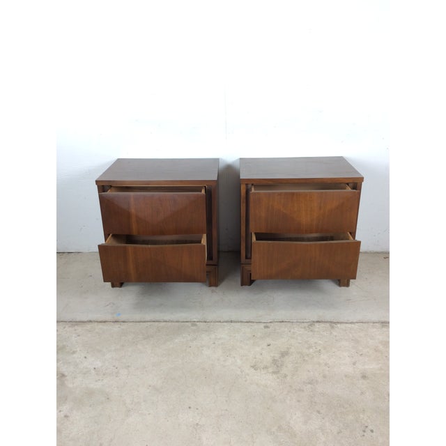 This pair of mid century modern nightstands by Johnson-Carper feature hardwood construction, beautiful walnut veneer with...