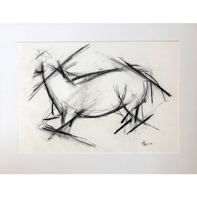 Abstract equestrian drawing, expressive charcoal, capturing the movement and spirit of the horse. The piece balances...