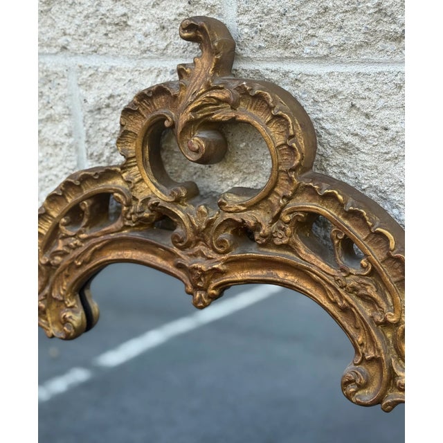 Stunning baroque style mirror with intricate carvings and patina gold leaf finish. Beveled mirror - excellent near new...