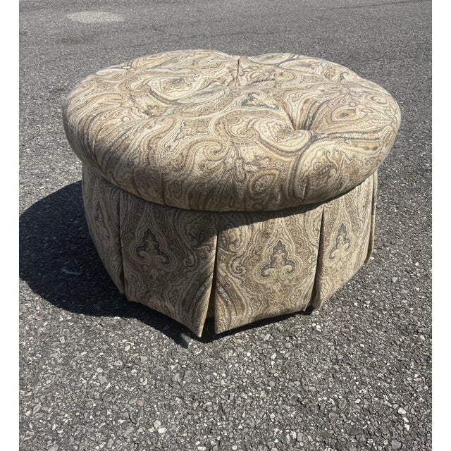 Sherrill Ottoman in a Beautiful Paisley Pattern of earth tone colors in a round design and comes complete on rollers.