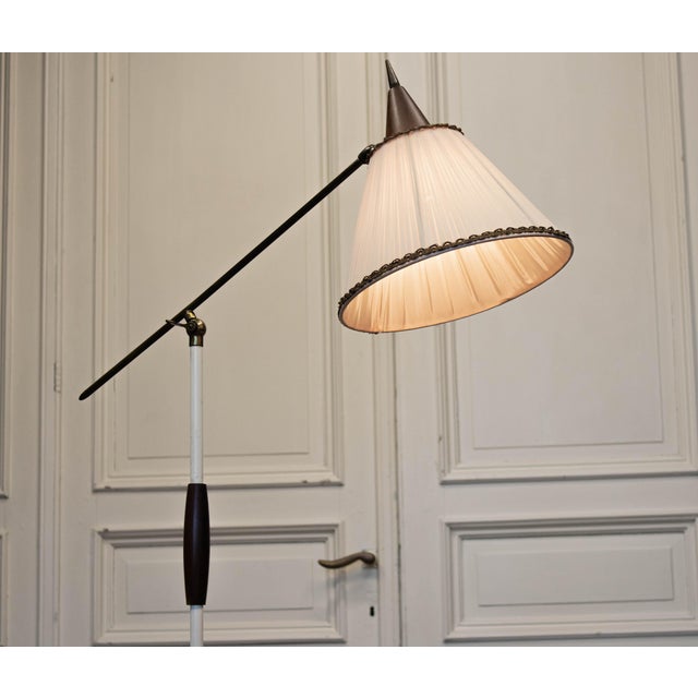 Elegant mid-century floor lamp produced by Van Doorn BV (Culemborg, The Netherlands) in the 1950s, incorporating...