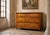 Louis XV Cherrywood Commode – 18th Century An elegant solid cherrywood commode with three large drawers in the front. This...