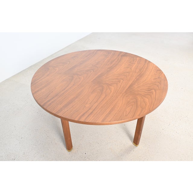 This refinished Dunbar Furniture coffee table by Edward Wormley is a stunning example of mid-century modern design,...