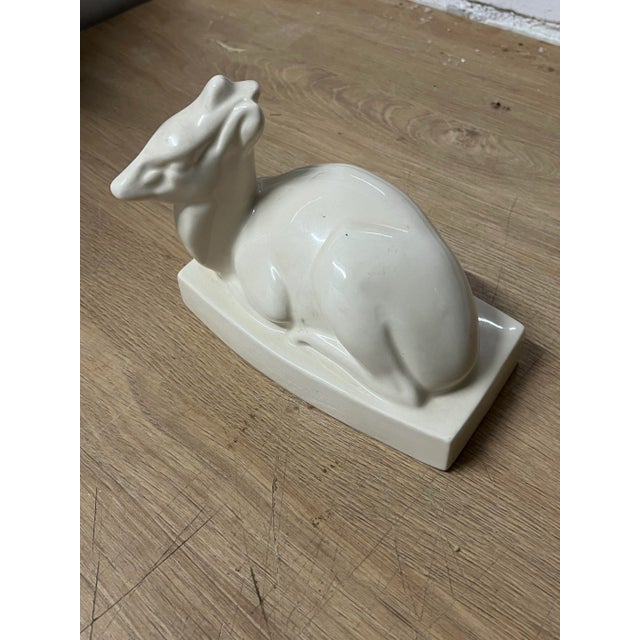 A ceramic model of a Duiker by John Skeaping for Wedgwood. Cream glazed with printed Wedgwood marks to underneath. Circa...