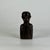 A gorgeous early 20th Century hand carved bust of an African male figure in a most composed and enigmatic pose. The...