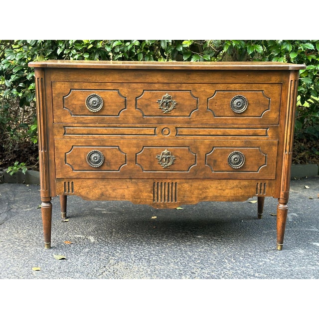 Exceptional Louis XVI Style 2 Drawer Walnut Commode by Baker. This chest represents Baker furniture at its best. The...