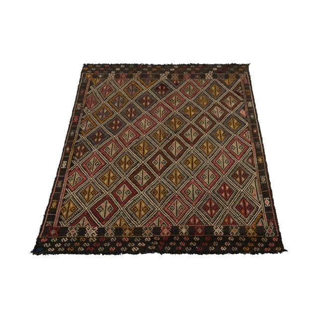 A vintage Kilim rug in 5x6, from a prominent new curation of the Cecim tribal rug family joining our collection. Handwoven...