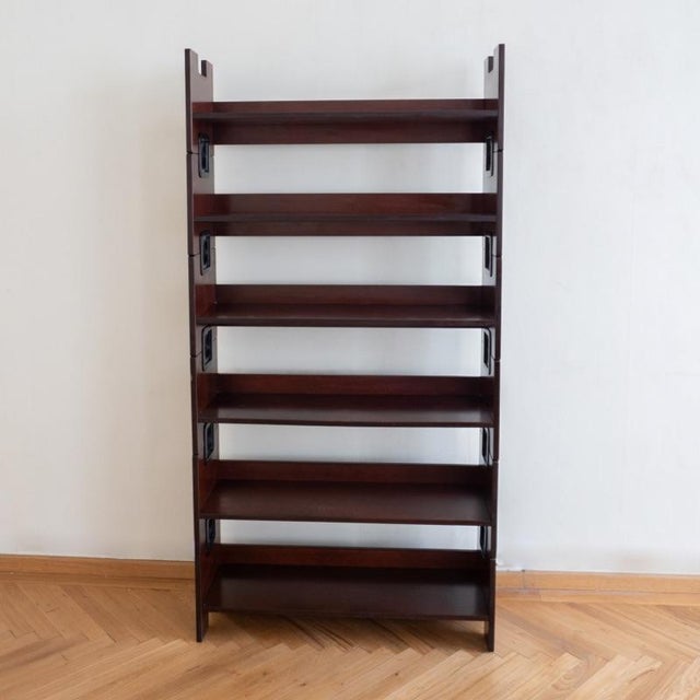 Introducing the bbb bonacina stackable veneer wood bookcase with black plastic accents - a contemporary storage marvel!...