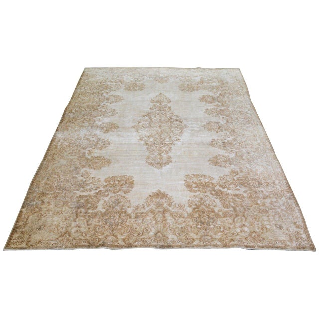 Hand-knotted with care using traditional rug-making techniques, this wool rug blends timeless craftsmanship with a modern...