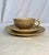 An elegant and finely detailed Japanese Satsuma tea set comprising a teacup, matching saucer, and dessert plate, all...