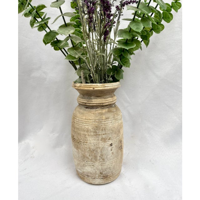 Rustic bleached turned wood vessel with natural patina. Wood grain and knots add character and charm. Crafted from a...