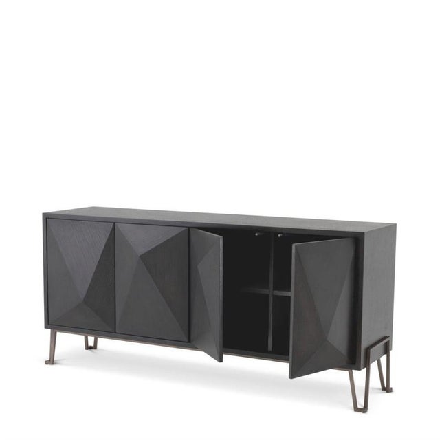 Dresser in charcoal brown oak veneer with a stainless steel frame in a medium bronze finish. Its doors feature triangular...