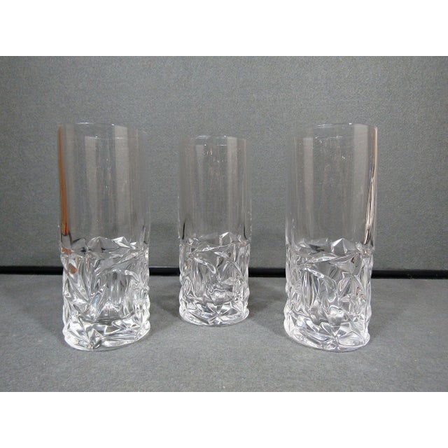 A refined set of three Tiffany & Co. crystal highball glasses in the Rock Cut pattern, each designed with a beautifully...