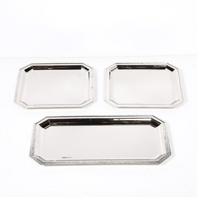 This set of three silver plate trays by Reed & Barton, crafted in America during the 20th century, exemplifies the brand's...