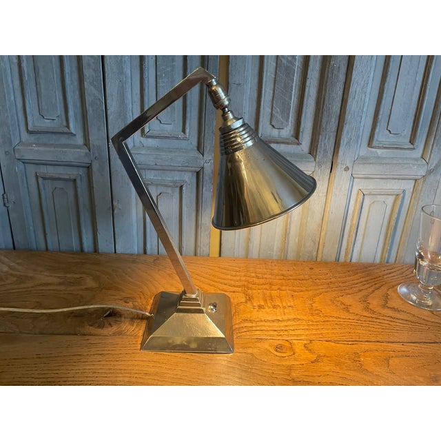 A beautiful desk lamp from the French Art Deco period of 1930. The lampshade can be used in multiple positions, as you can...