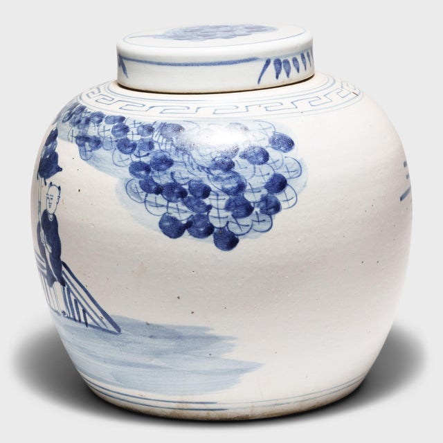 Loosely brushed with cobalt blue pigments, this round, blue-and-white storage jar is underglazed with a celebratory...