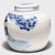 Loosely brushed with cobalt blue pigments, this round, blue-and-white storage jar is underglazed with a celebratory...