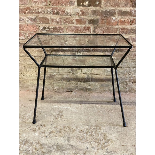 Iron frame and glass top table reminiscent of Milo Baughman for Pacific Iron Works. Featuring two glass tops with a nice...