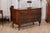 A Venetian walnut and mahogany commode from the 18th century with four drawers, bookmatched veneer, cross banding and...