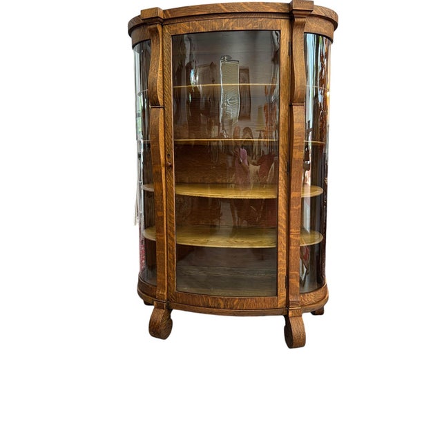 Antique American Tiger Oak Bowfront Curio Cabinet, circa 1895–1910. Crafted in richly figured quarter-sawn oak with...