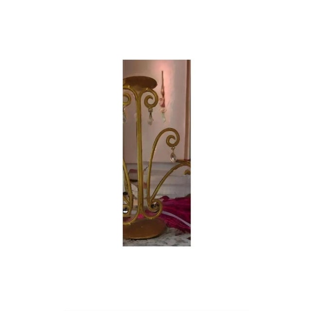 This piece features ornate curves, and serves as a graceful stand suitable for holding a variety of things. Measuring...