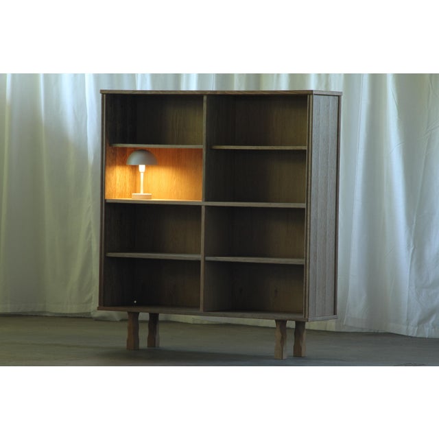 A unique 1960s Danish oak bookcase with a strong architectural character and a beautifully understated presence....