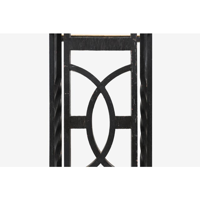 An elegant Belgian Art Deco umbrella stand from the 1920s, featuring a geometric openwork design in black‑painted metal...