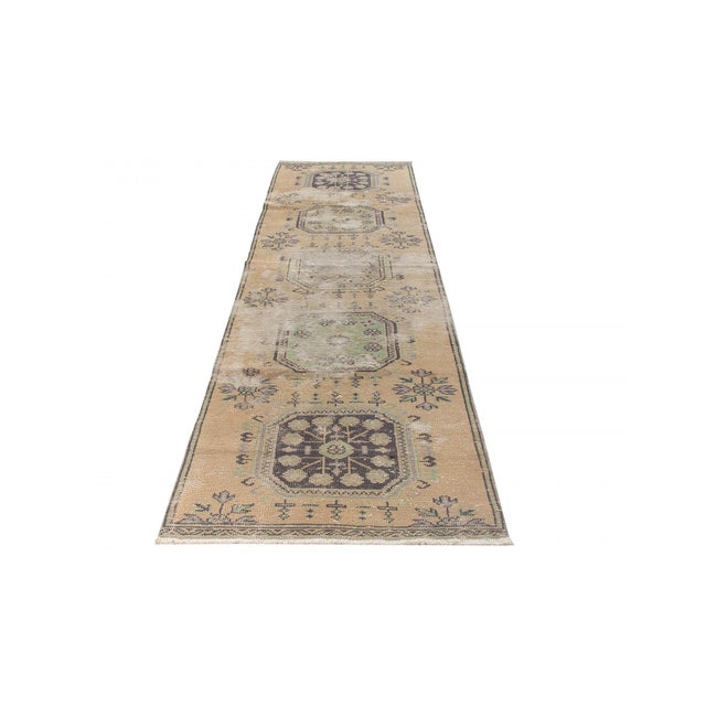 Decorative washed out handknotted vintage rug from Konya region of Turkey. Approximately 50-60 years old. In very good...