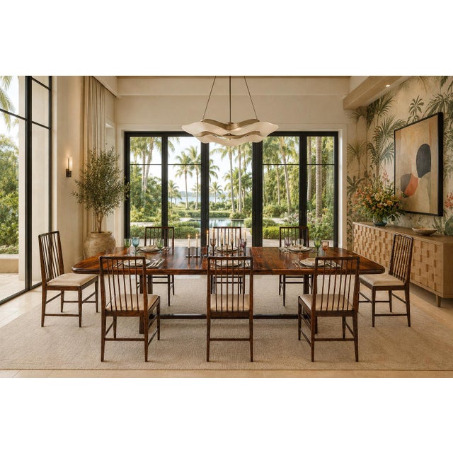 This sculptural set of eight Brazilian Modern dining chairs was produced by Celina in the 1960s. Each chair is defined by...
