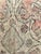 Moroccan floor pouf made from an abstract midcentury rug handwoven in shades of muted pink, gray and beige hand spun wool....