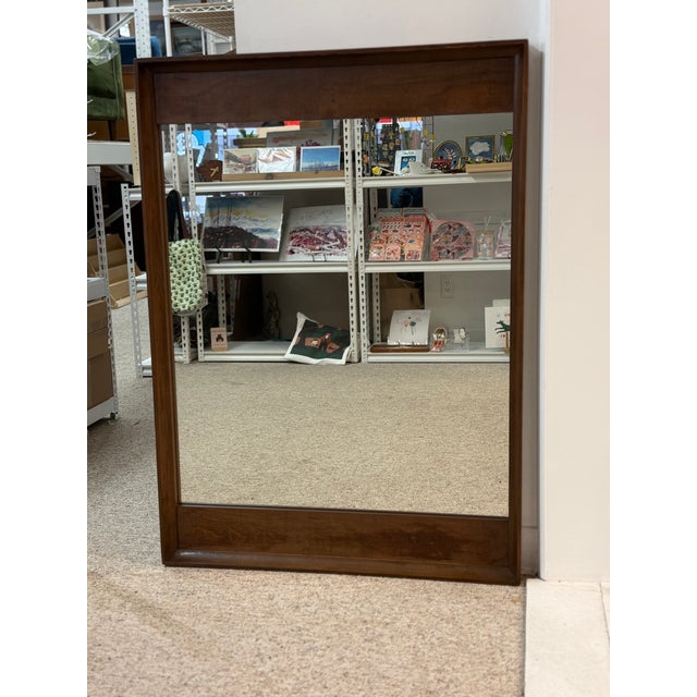 This mid-century modern mirror by Stanley exemplifies the era’s signature blend of simplicity, functionality, and natural...