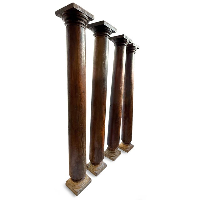 Set of four beautiful deep rosewood antique columns with sandstone bases. Both base and top are 10" square. One column is...