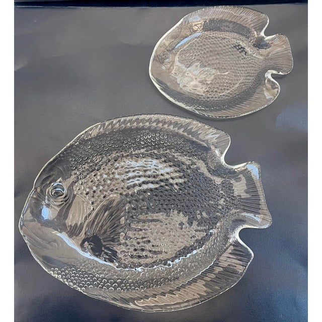 Set of eight fun French vintage beautifully detailed fish plates. Set consist of 4 large dinner plates in the shape of a...