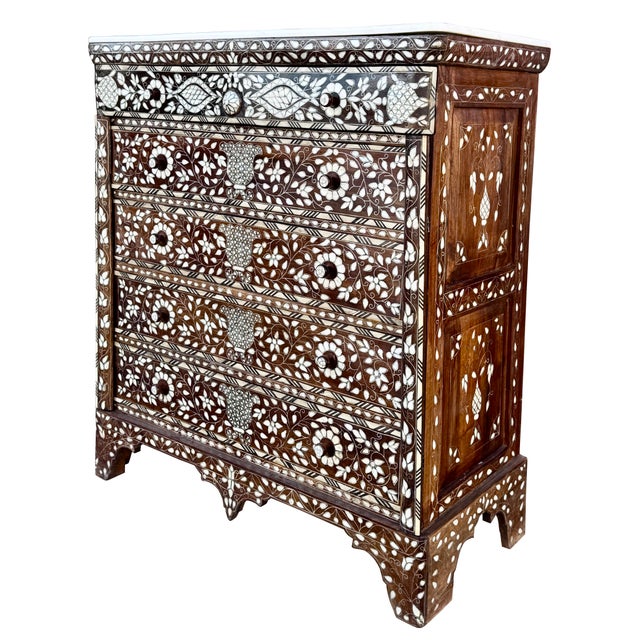Exotic Handcrafted Mother-of-Pearl Inlaid Chest of Drawers with Marble Top An exceptional mid-19th century chest of...