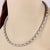 This authentic necklace is by Zancan, well crafted from 18k white gold with alternating brushed and polished tube like...