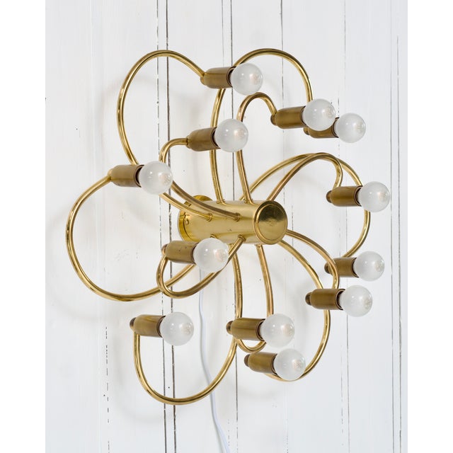 Brass ceiling "Swir"l lamp for twelve E14 bulbs. Can also be easily mounted vertically as a wall lamp. Designed by Geatano...