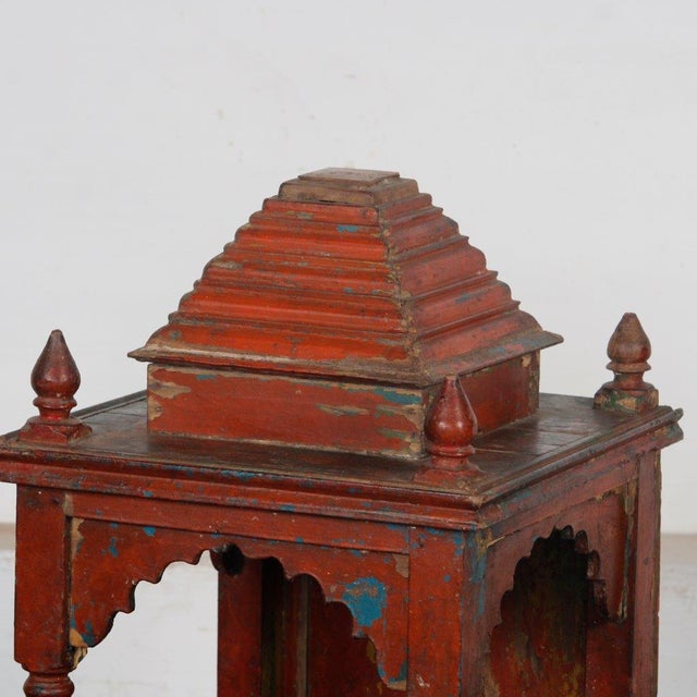 Vintage Indian Painted Teakwood Mandir or Home Temple, with a stepped pagoda style top, scalloped archways on 3 sides and...