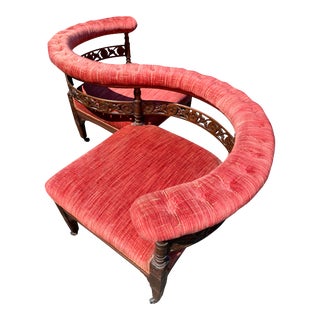 Early 20th Century Antique Tete a Tete Settee With Tufted Armrest and Carved Wood Detail For Sale