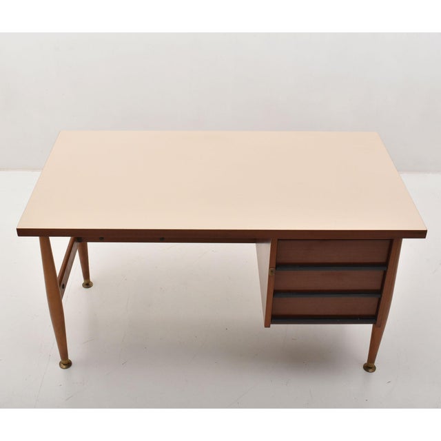 1960s Schirolli-signed desk, an authentic example of Italian mid-century modern design, characterized by clean lines and...