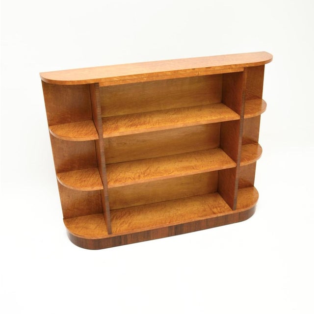 A beautiful and very striking Art Deco Birdseye maple open bookcase. This was made in England, it dates from the 1930’s....