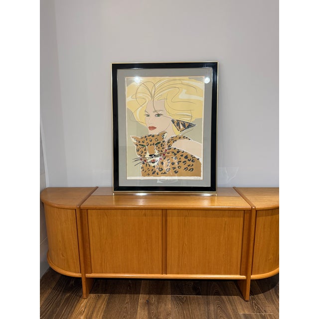 A striking signed and numbered “Cheetah Woman” serigraph by American artist and fashion illustrator David Croland,...