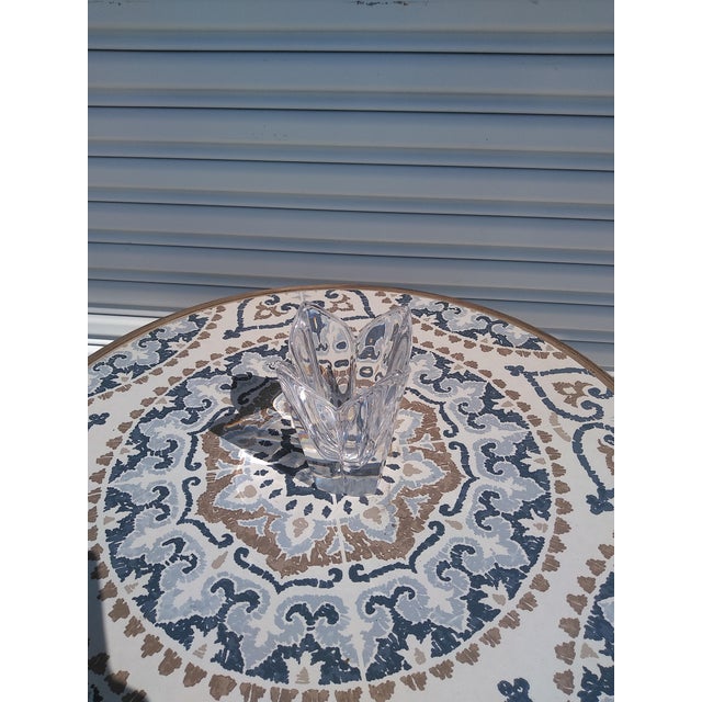 This vase is made out of heavy Crystal. It designed in the shape of a lotus. It makes for a great centerpiece or side...
