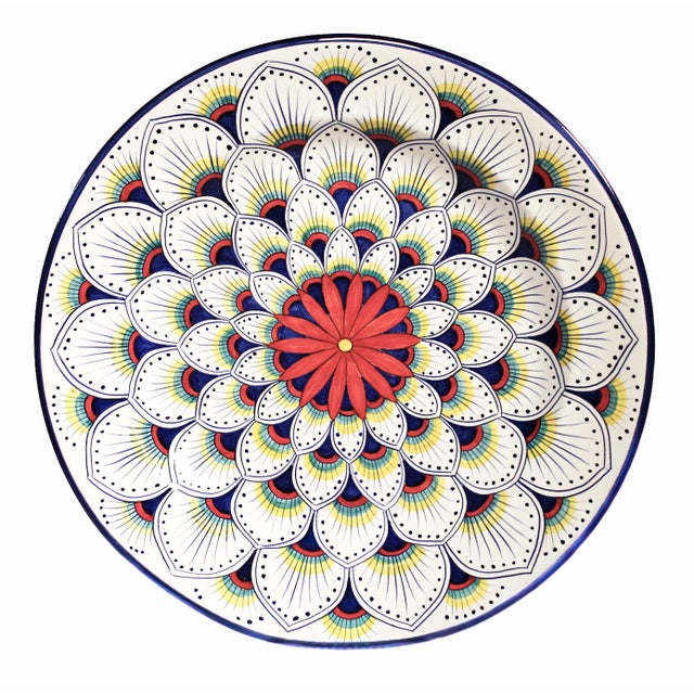 The Intreccio Round Serving Platter brings centuries of Italian ceramic artistry to your table. Hand-painted by master...