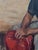 “The Skipper” is a signed original acrylic painting on canvas by Kay Mollison. This expressive portrait depicts a seated...