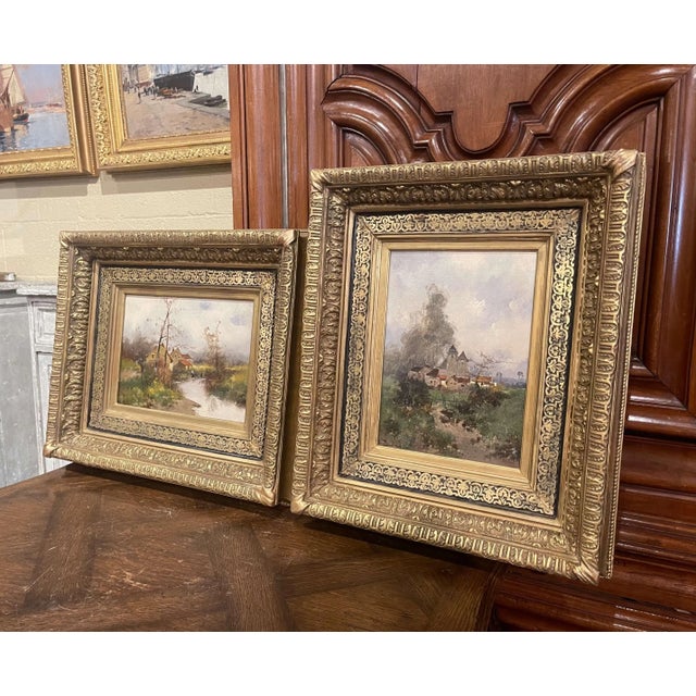 Composed as a fausse paire, these two antique oil paintings present complementary views of the French countryside, with...